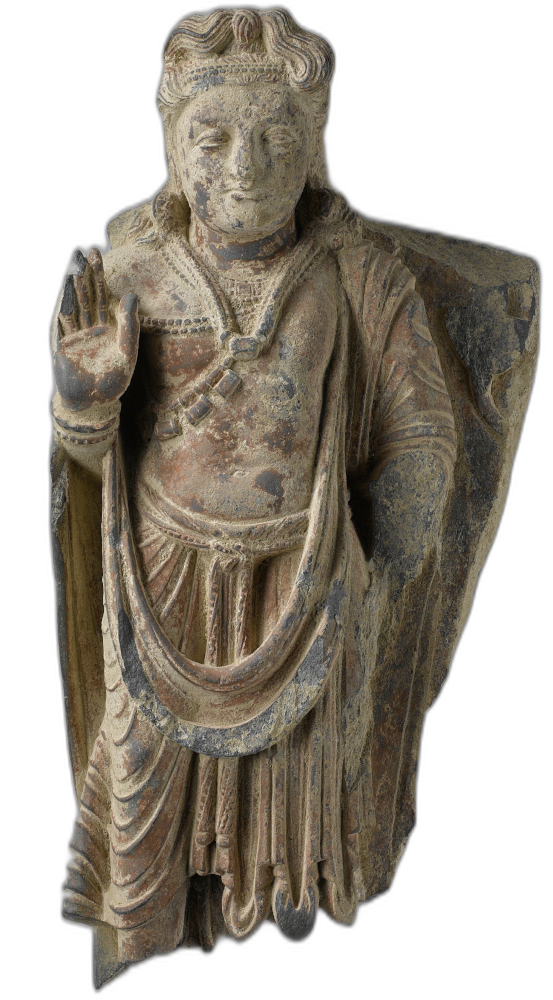 A stone-hewn statue of a figure with flowing hair